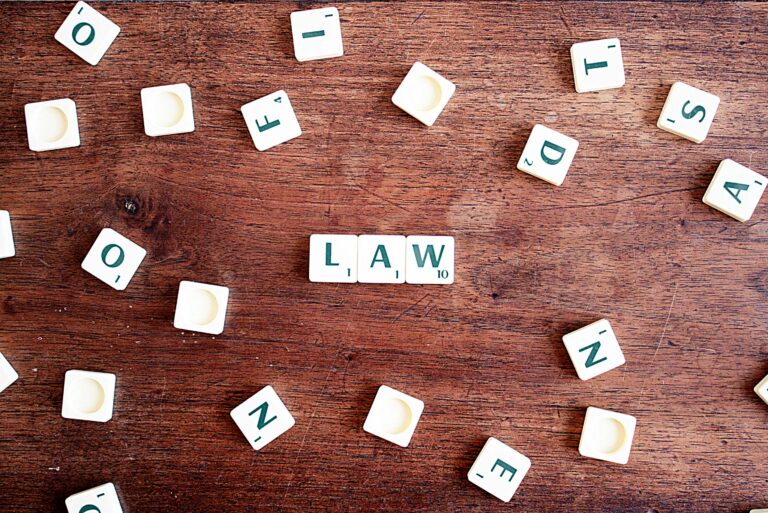 Scrabble letters spelling out 'LAW'